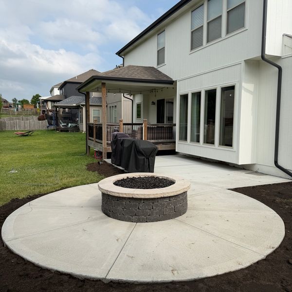 Concrete patio installation, with Belgard gas fire pit. Kansas city