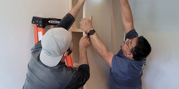 SOSN Woodwork team installing some cabinets