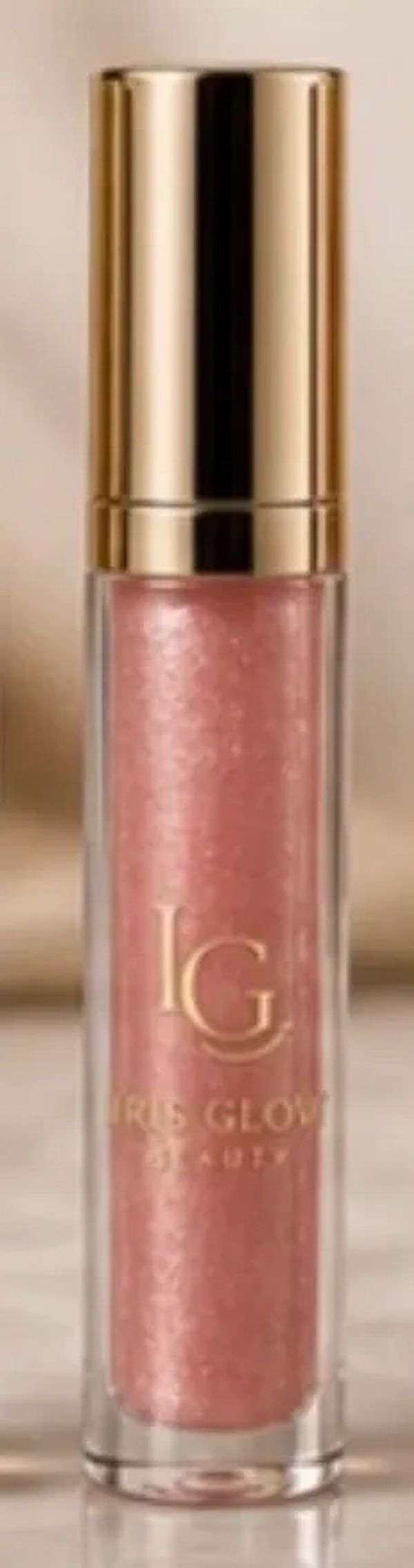 Glossy pink lip gloss with gold cap.