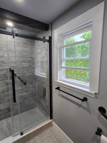 double pane window with ledge with matte black walkin shower