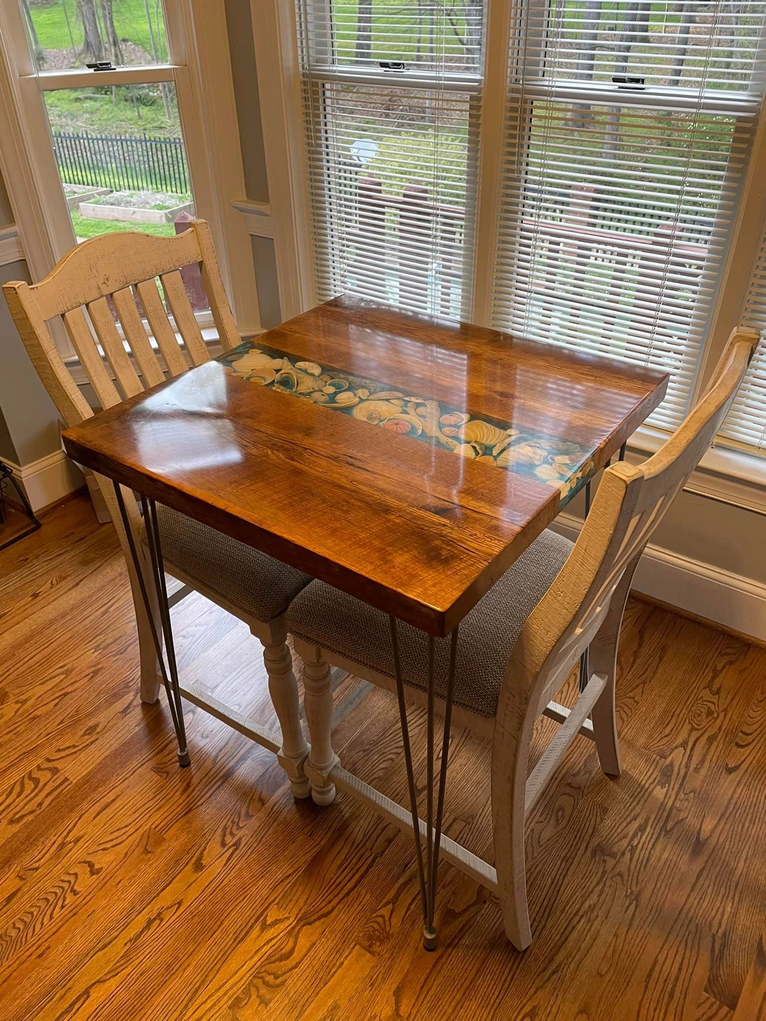 Salvaged Oak Plank table with locally sourced seashells.