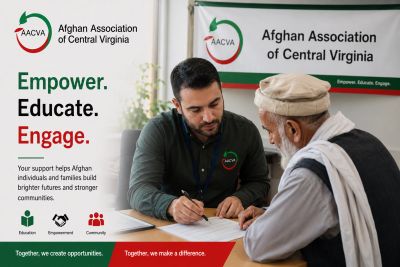 A volunteer assists an elderly man at the Afghan Association of Central Virginia.