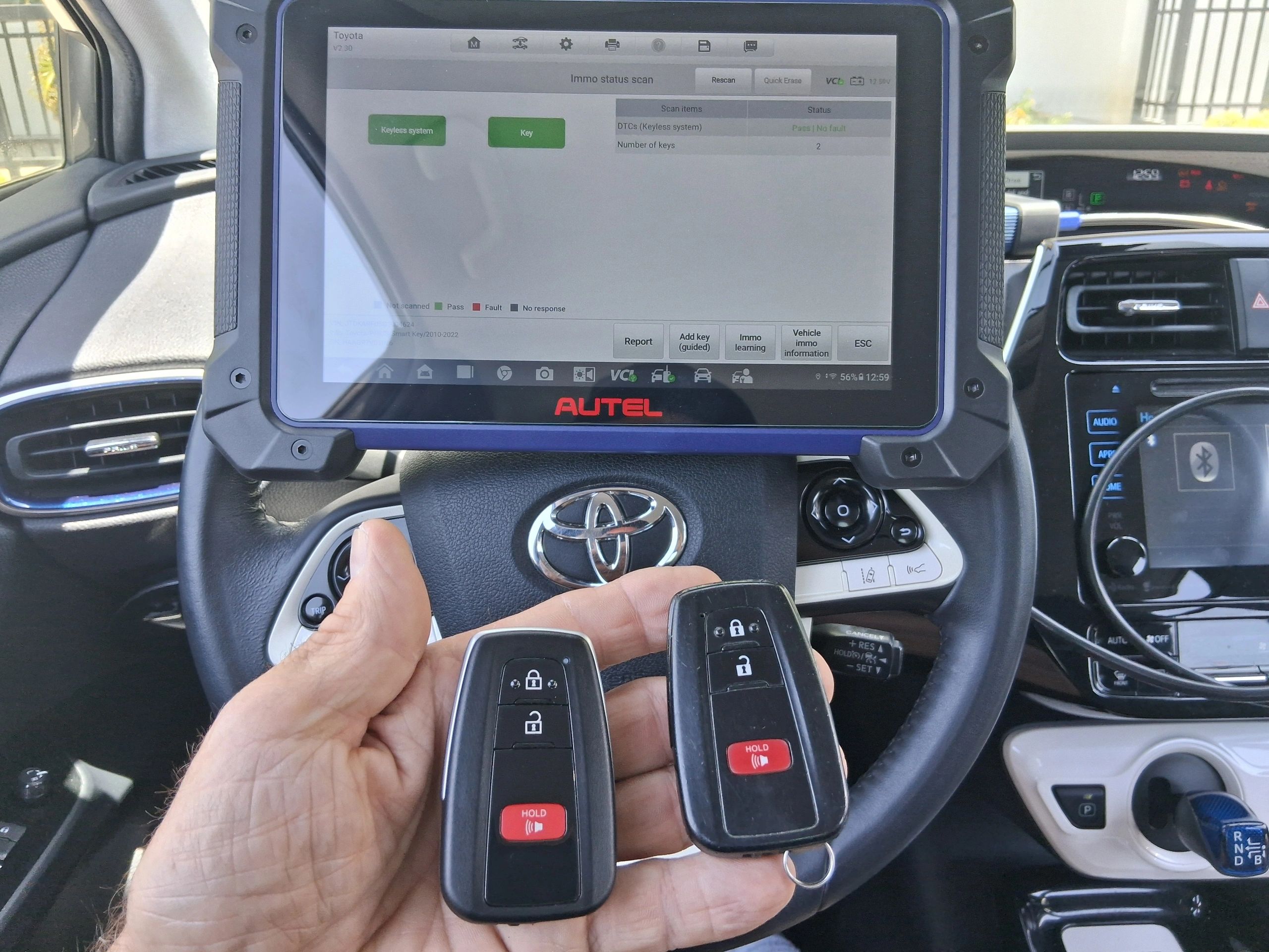 2016 Toyota Prius New Programmed Autel aftermarket smart key next to original key
