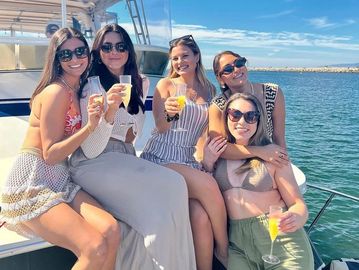 Girls drinking mimosas on 59ft Island Boat MDR in Marina Del Rey.