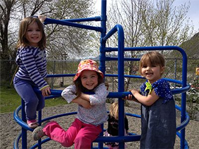 three little girls in the playground