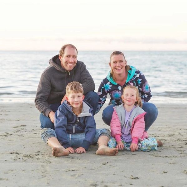 Two happy parents supporting two children with Dyslexia.