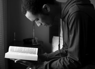 black man reading bible