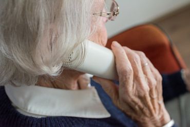 Old lady speaking on phone