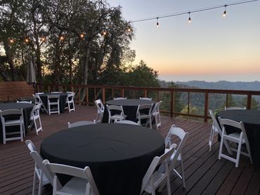 Black linens for a sunset event on the large deck