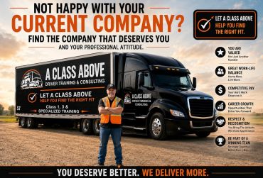 A man stands in front of a truck advertising driver training and consulting.