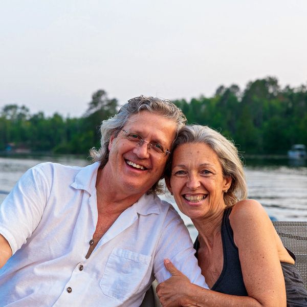 Cherie and husband, Kyle , heads together, smiling!