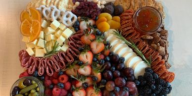 Charcuterie boards with jams and jellies. Fruits. Gourmet cheese and cured meats. Pickles and olives