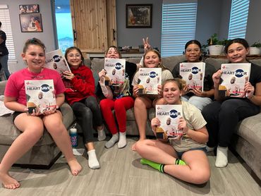 Girl Scouts earn first aid badge.