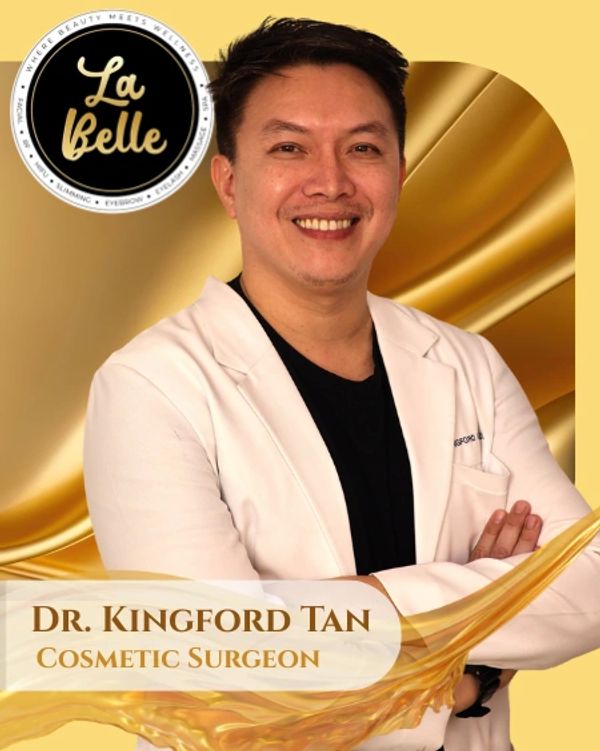 Dr. Kingford Tan, a smiling cosmetic surgeon in a white coat.