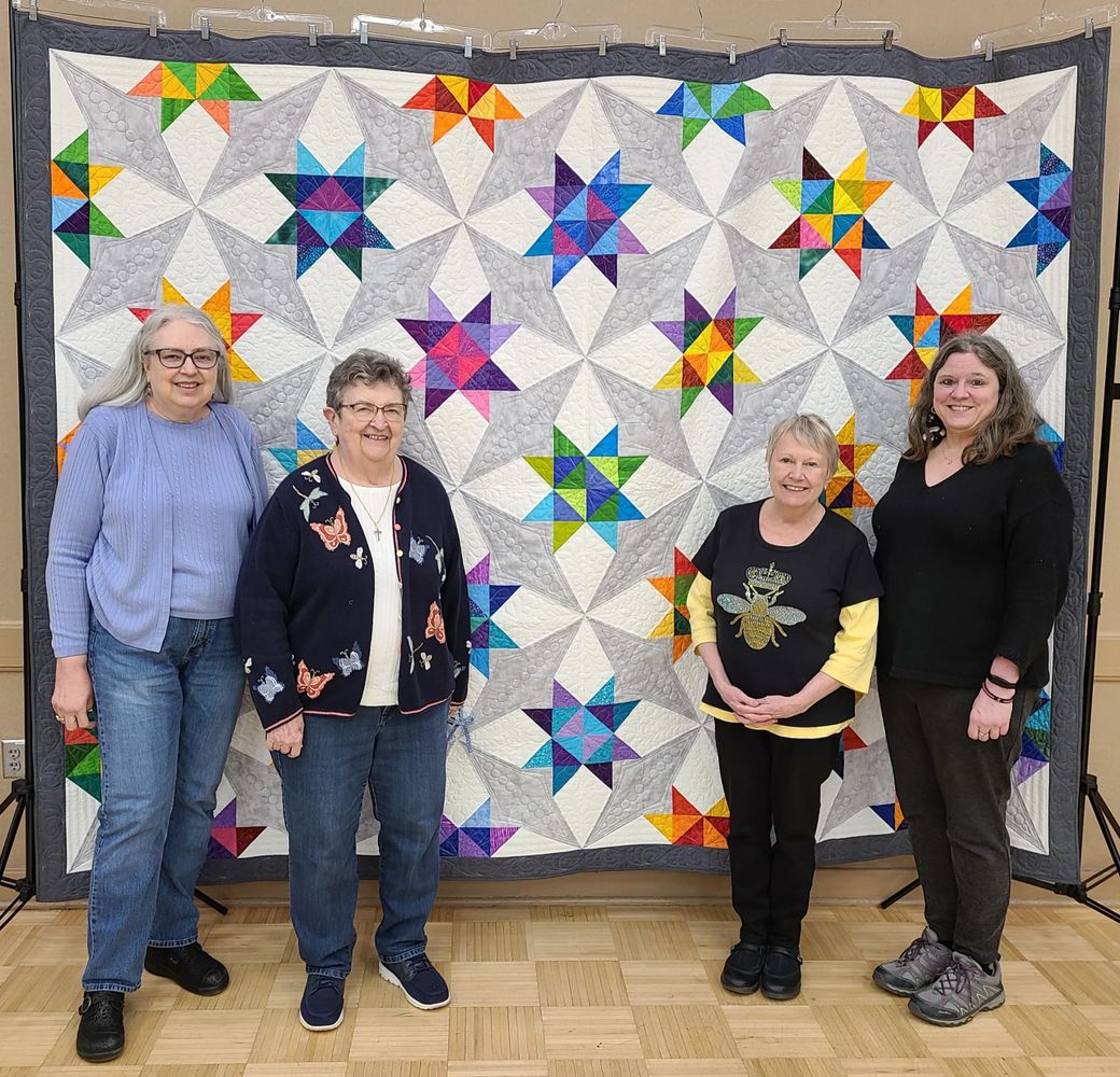 A few of the creators of the 2025 Raffle Quilt.