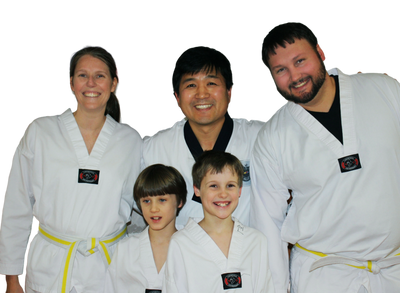 A family practicing taekwondo together