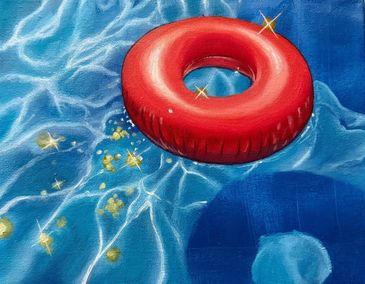 Red inflatable ring floating in a sparkling pool.