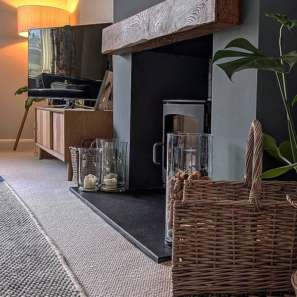 Cosy fireplace interior design with plants and decor