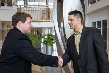 Koola Logistics team in Carmel discussing freight brokerage opportunities.