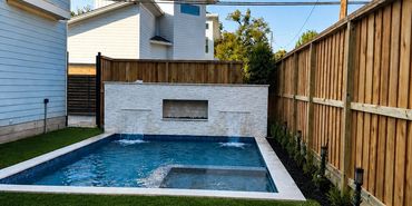 Cedar privacy fence installation around a backyard pool in Houston