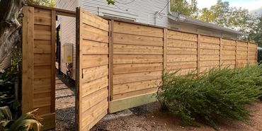 Horizontal cedar privacy fence and gate installation in Houston Heights