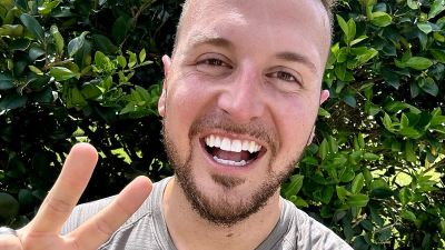 Chase DeMayo smiling outdoors