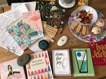 A selection of therapy books available for people to use at a workshop based on self care