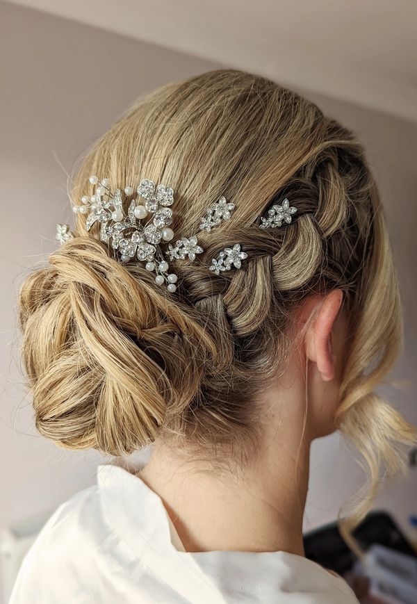 low bun hairstyle with plait