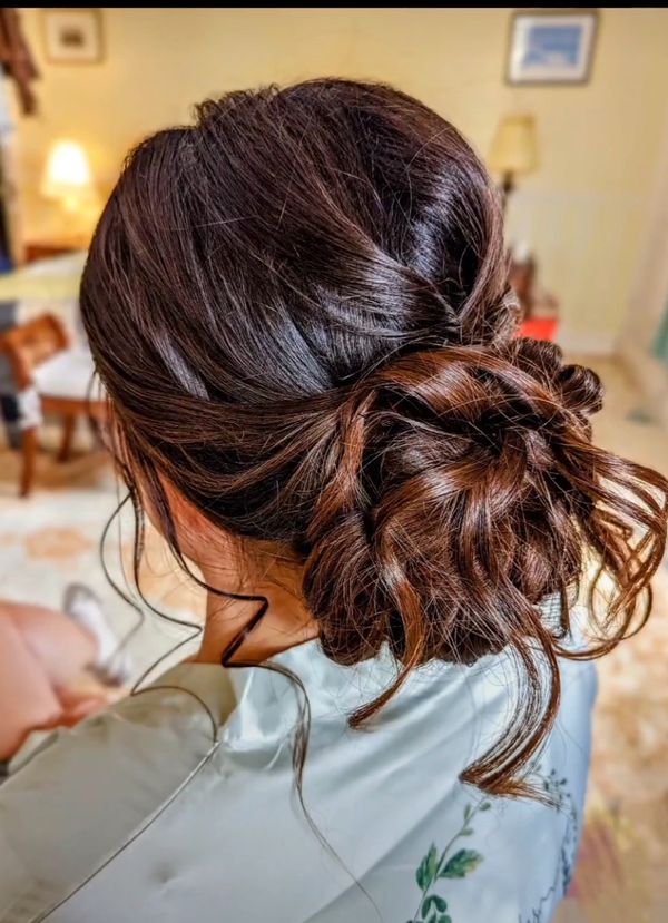 messy low bun hairstyle