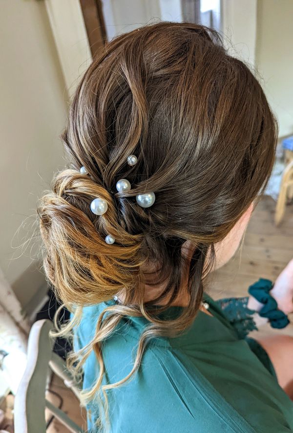 low bun hairstyle for bridesmaid