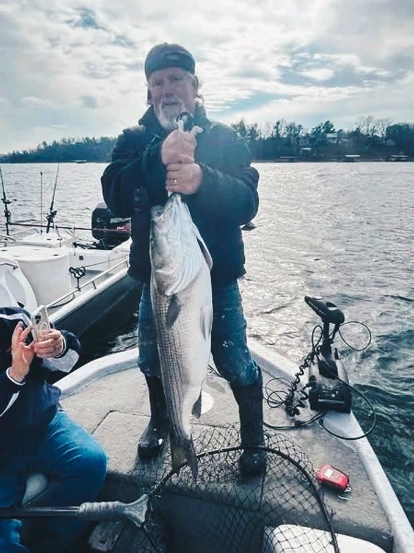 Bobby Schoenberg, our other boat captian with a nice striper. Get your trip scheduled