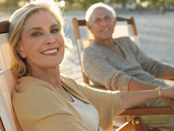 Retired couple enjoying the beach.