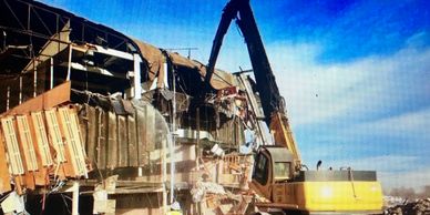 Our high reach demolition excavator allows us not only to reach up ten stories but also allows us to