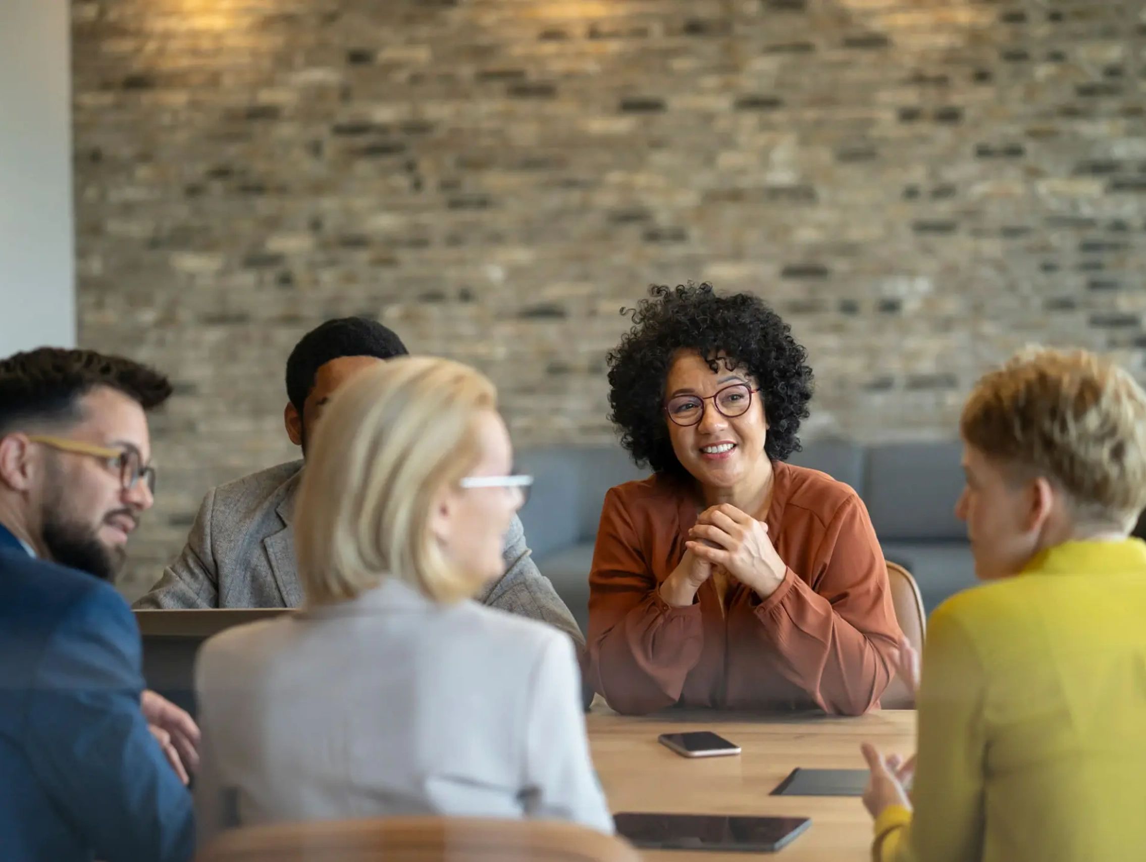 Group of diverse colleagues collaborating in a meeting.