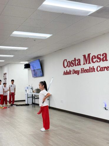 Children practicing martial arts indoors at Costa Mesa Adult Day Health Care.