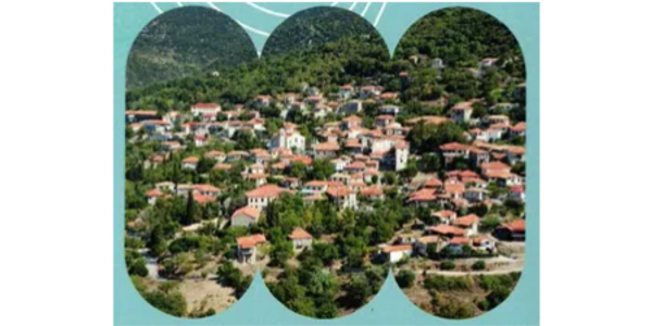 A scenic view of a hillside village with red-roofed houses surrounded by greenery.