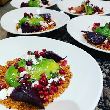 Beet and avocado salad, pomegranates, feta, and breadcrumbs