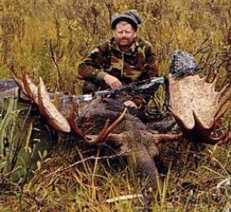 Picture of a Close Encounters Bowhunts client with an archery bull moose