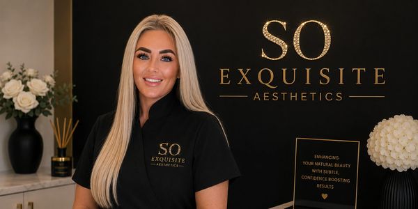 Woman smiling at So Exquisite Aesthetics clinic.