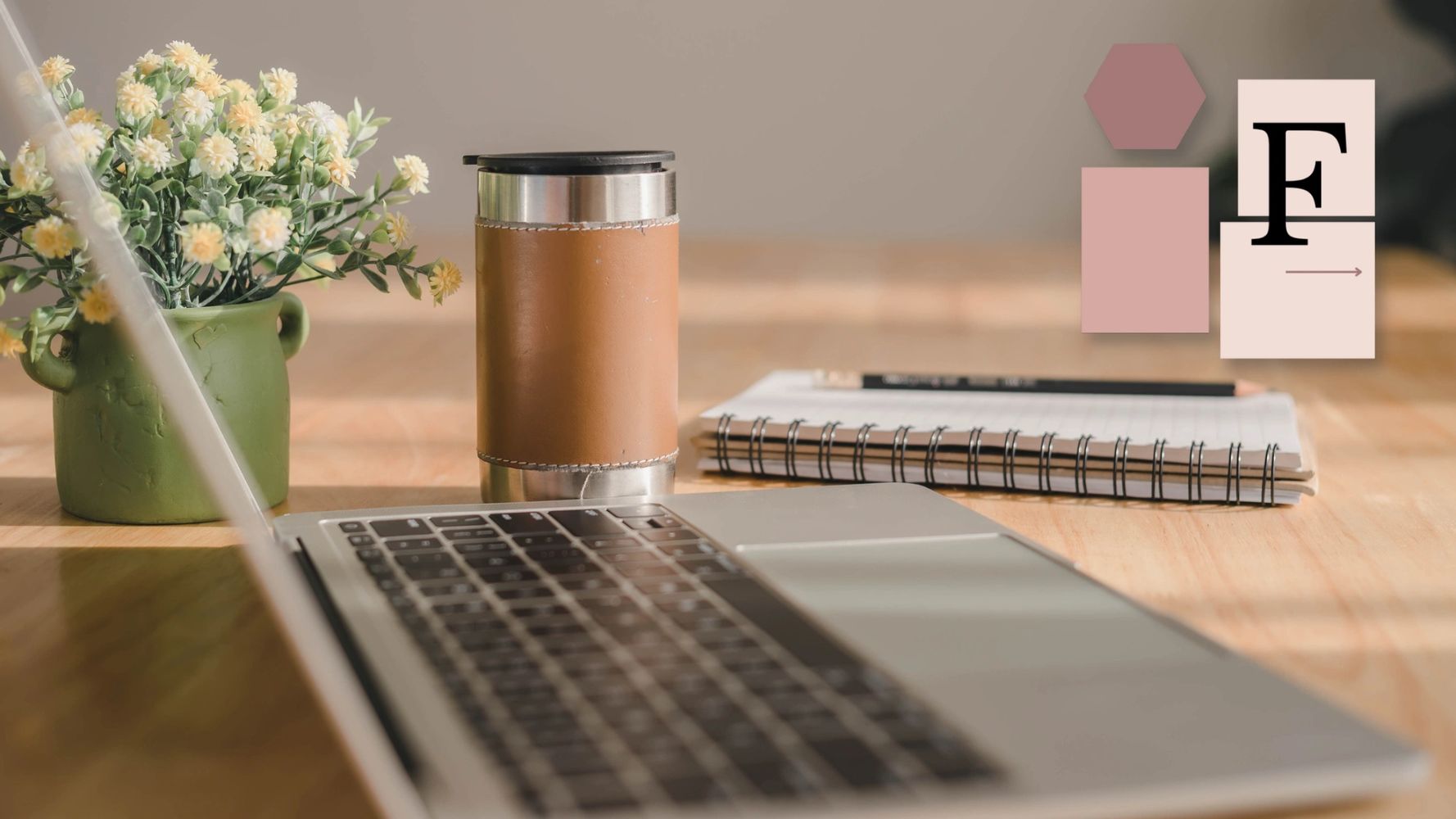 Laptop, mug, and plant on desk in soft light — representing calm, creative work for women 40+.