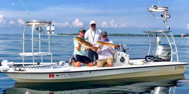 Captain Daniel Snapp with clients on a Grassy Flats Charters fishing trip!