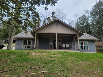 Front view of blue Aspen cabin with tan trim at Star Point.