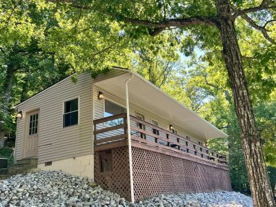 Beech cabin exterior with covered deck at Star Point Resort on Dale Hollow Lake