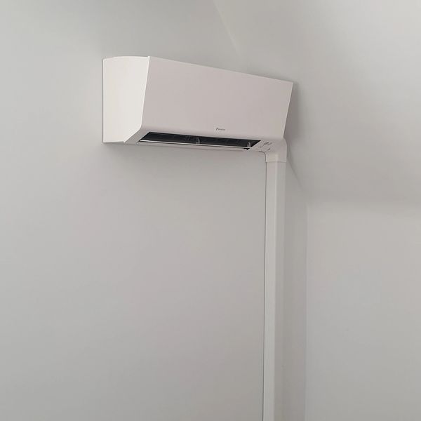 a Daikin Perfera indoor unit installed in a loft space