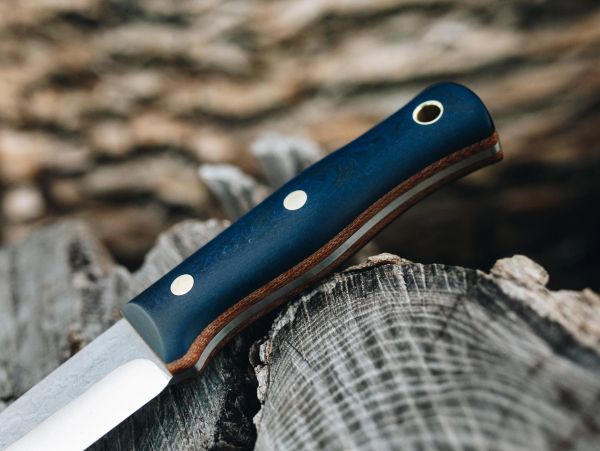 Close-up of knife handle on wood.
