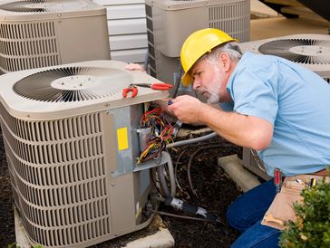 Mature Repairman Works On Apartment Air Conditioning Unit