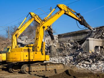Demolition excavators at work on an old train viaduct