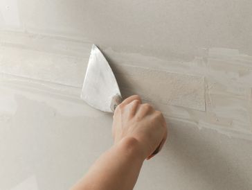 Fixing dry wall surface and preparation for painting.