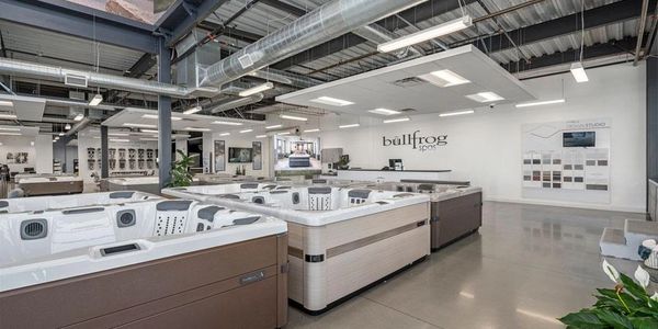 Showroom displaying various Bullfrog Spas hot tubs in a bright, modern space.