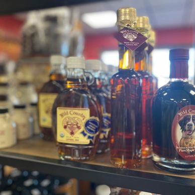 Photo of specialty syrups and honeys by local providers.
